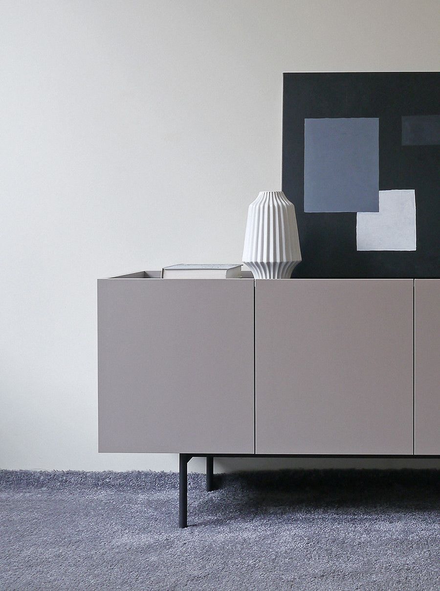 Modern cabinet on legs in the living room Modern cabinet on legs in the living room